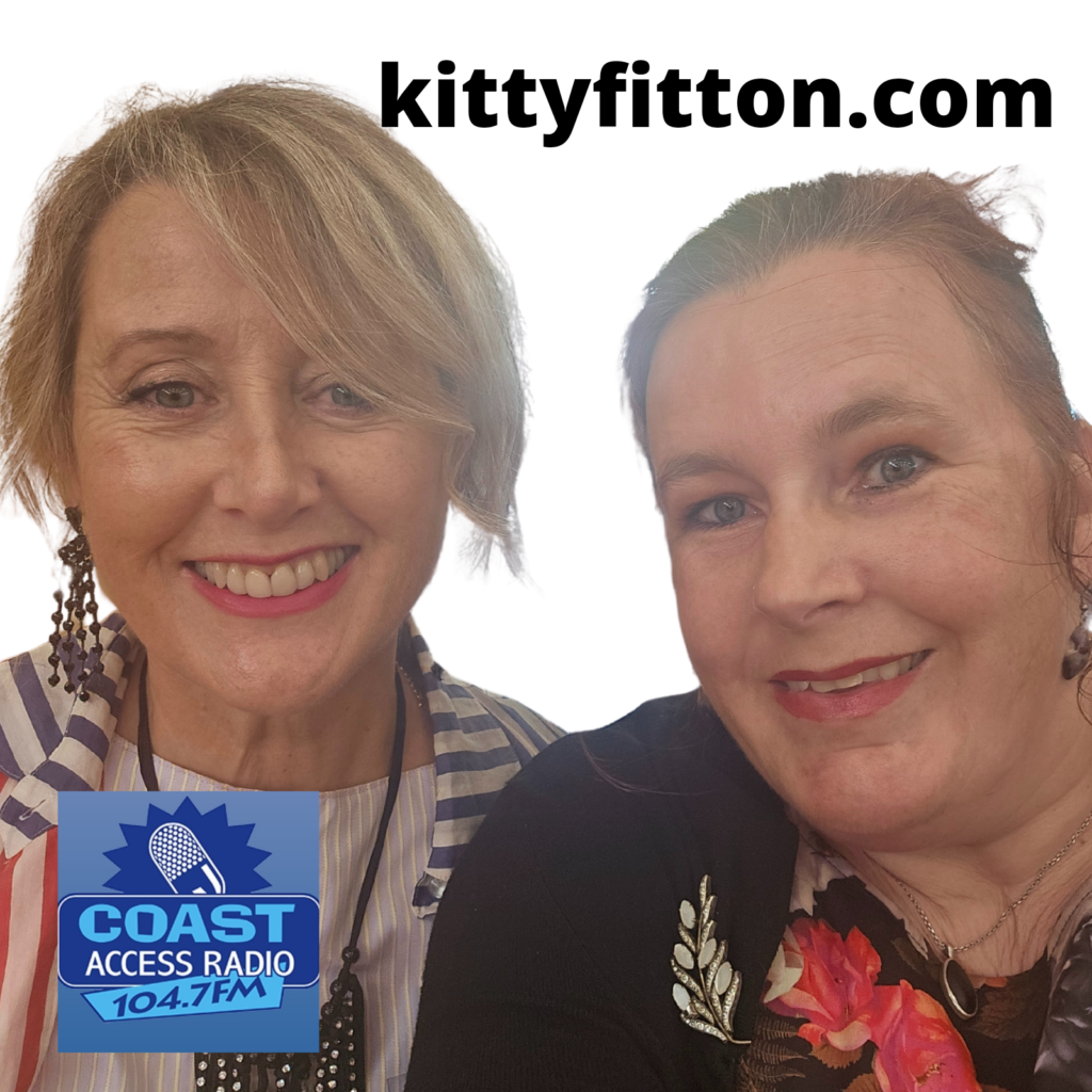 two women, Catherine Scullin and Kitty Fitton smiling into the camera
