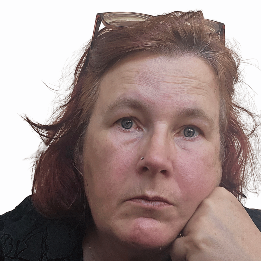 image of kitty fitton staring with blank expression into the camera. 